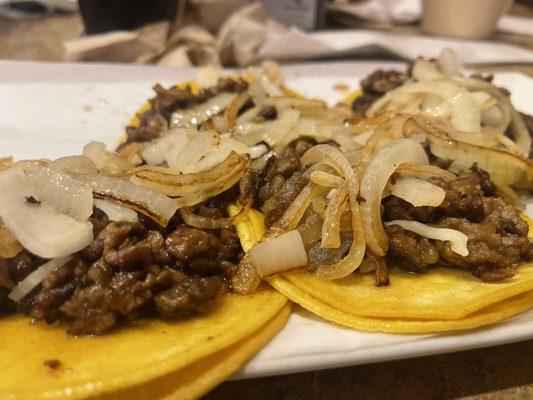 4 beef fajita tacos with grilled onions