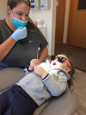 Dr. Gragg teaching a patient how to look with a mirror