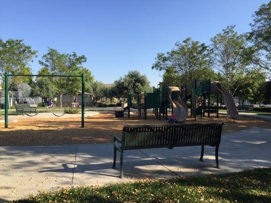 Bench with shade. Helps when summer temperatures avg in the 90s.