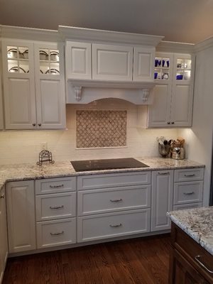 Kitchen Remodel in West Chester.  Custom hood over electric cooktop.  Tile backsplash.