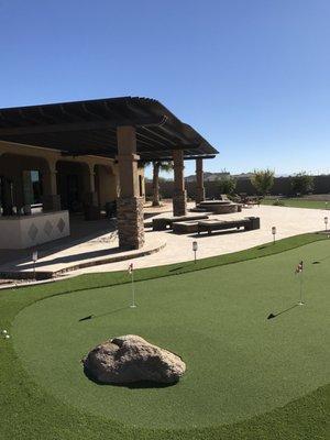 Complete custom yard. 
 Travertine Decking, Built in BBQ, Putting Green, Custom fire pit, And custom Stone pillar with pergola