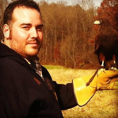 Russ with the 11 year old Harris' Hawk!