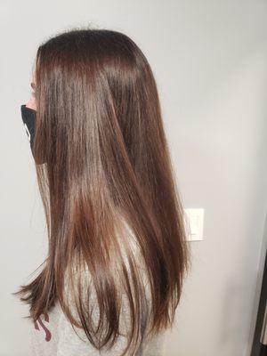 Long layerd haircut and beautiful brunette hair color on think hair.