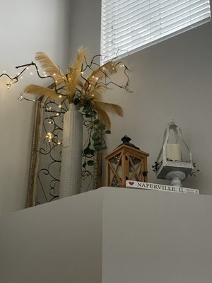 Tall arrangement with fairy lights with timer and remote control.