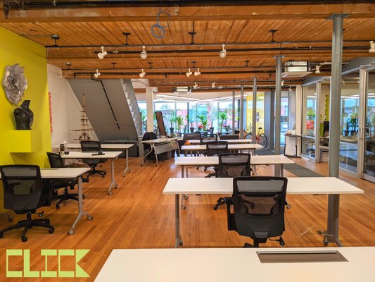 The Open Space at CLICK Workspace. Open Space Members and Day Pass Visitors are welcome to work at any open desk in this ground floor space.