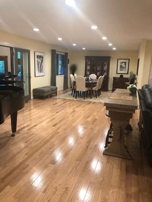 Wall in dining room and wall in living room removed and with the addition of lighting, opened up the entire space.