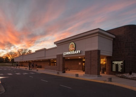 Front entrance & loading area in the foreground and evening sky with the sunset in the background.