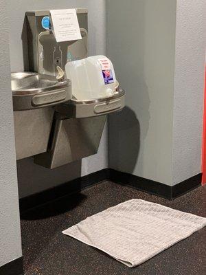 Hazard- Broken water fountain and broken water jug.