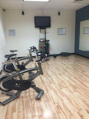 Additional workout room with fitness videos and weights