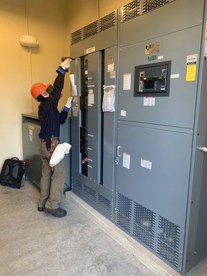 Electrical engineer performing a site audit with category 2 PPE