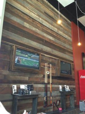 TV's and wood floor wall, pretty cool atmosphere.