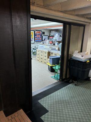 Entrance to store in basement of building.