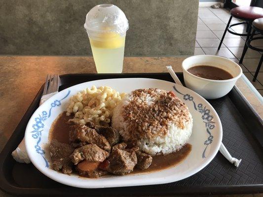 Beef stew, rice, macaroni salad, and beans