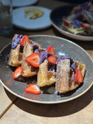 Waffle with blueberry cream and strawberries