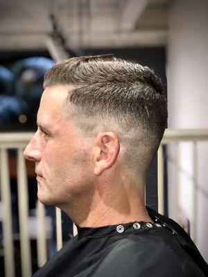 A classic haircut with a height fade