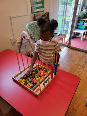 Enjoying math manipulative toys.