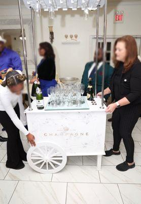 The champagne chart was broken. Wheel and handle falling off. Not filled as requested. Brought out in the middle of reception.