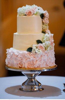 Our wedding cake! We added real flowers to the top to match the centerpieces!