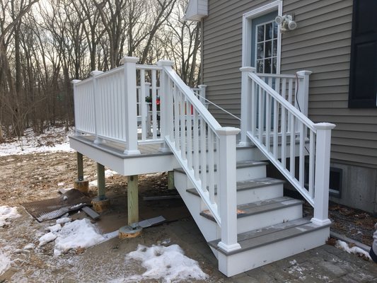 Composition decking with vinyl railing system