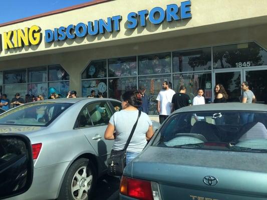 The line for graduation balloons waiting for the store to open