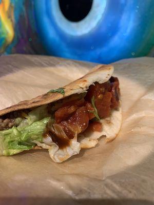 Fried "Alton" Tacos. Made with smoked ground beef and refried beans, topped with vinaigrette seasoned lettuce and tomatoes