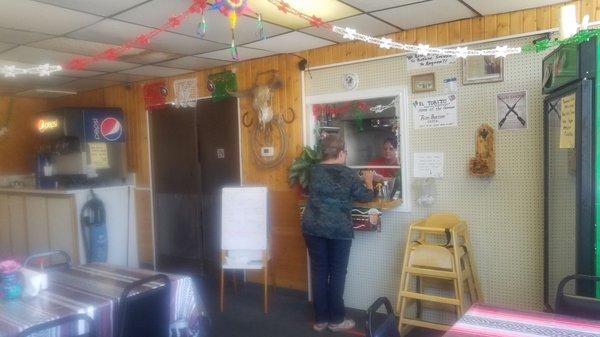 Left side of the restaurant where the servers entrance and the kitchen is