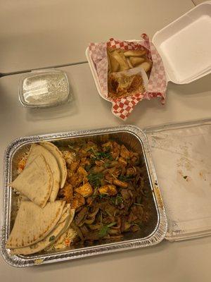 Gyro and Chicken platter served with fried Pita bread.