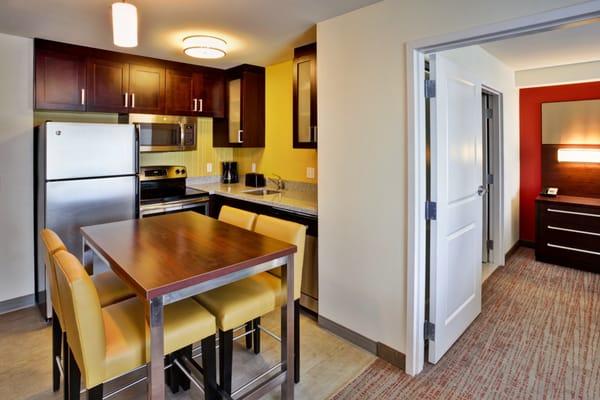 Kitchens in our Two Bedroom Suites provide plenty of table space for meals and game nights.