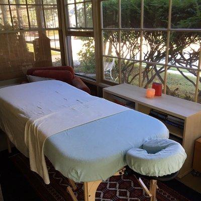 My massage table set up on a front porch.