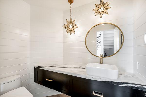 Powder room featuring wrap-around shiplap accent walls, custom floating vanity, new lighting fixtures, toto, and flooring