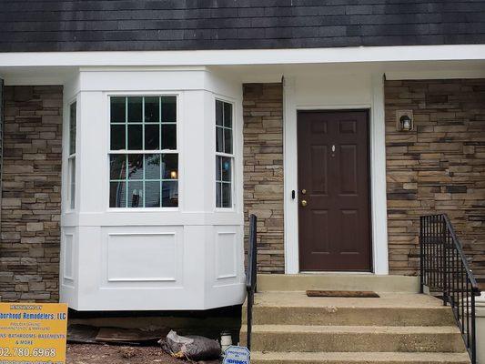 Cellular PVC rebuilt window bay and new stack stone siding.