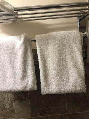 Stained towels with red and brown stains on them