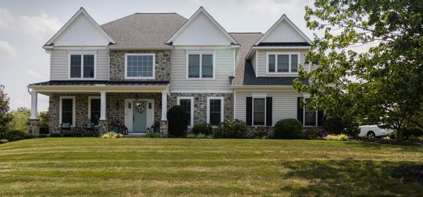 Remodel with new kitchen, finished basement, covered front porch and all new siding and stone.