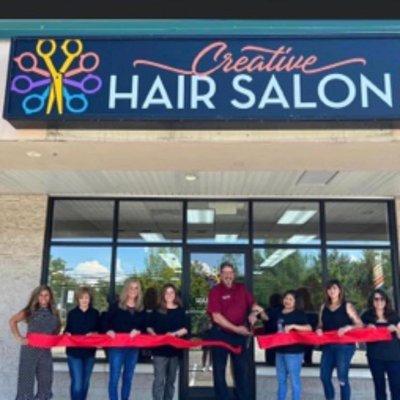 Staff in front of the salon.