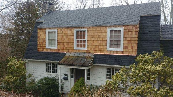 Removed old siding and installed new w copper flashing front and back.