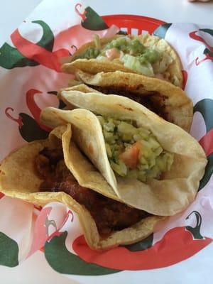 4 tacos : chorizo and potato $1, rice and guacamole $1, chicken molé $2, and shrimp $3. all delicious.