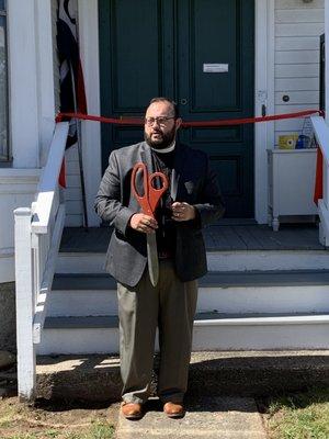 Father Dante cutting the ribbon on opening day, Saturday, September 2nd, 2021.