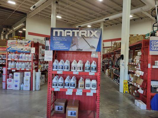 Rows of shelves with janitorial supplies and restoration equipment at Jon-Don Boston