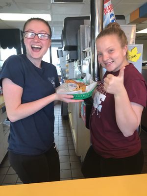 Two hotties with a baskets of tenders