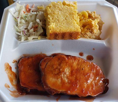 "Pork Pop" dinner, two loin chops dunked in a Cherry Dr. Pepper glaze and sides of house made Cornbread, Mac and Cheese, and Slaw.