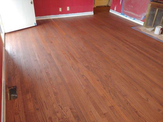 Red mahogany on red oak floor