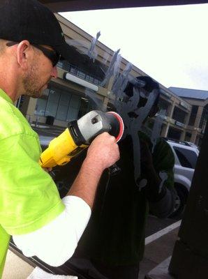 Removing Acid Etched Graffiti on Storefront Glass.