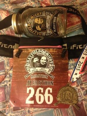 Race bib, Finisher's medal, & collectable mason jar.