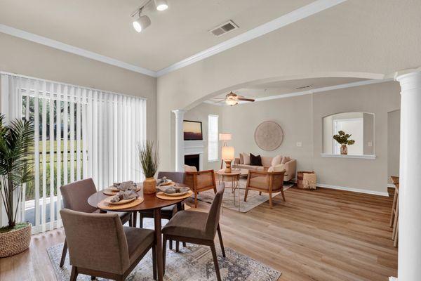 Living room with view of dining room at The Estates of Northwoods