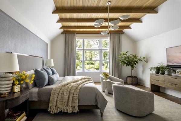 Primary Bedroom with white oak ceiling beams.