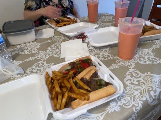 Three Philly cheese steaks and three Agua Fresca