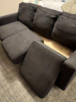 Sofa with pillows that won't stay on.