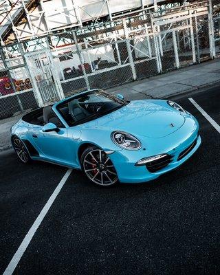 Porsche 911 convertible fully wrapped in Miami Blue