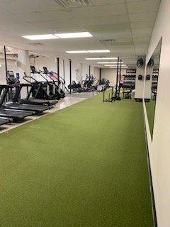 Large upstairs area dedicated to cardio equipment, stretching, sled work, and many other things!