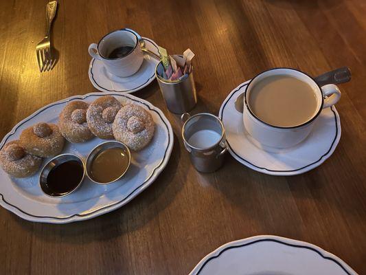 Donuts with chocolate and caramel syrup. We ordered a coffee and espresso to go with it.